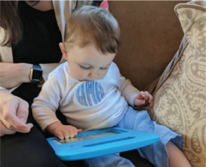 Baby playing on a tablet